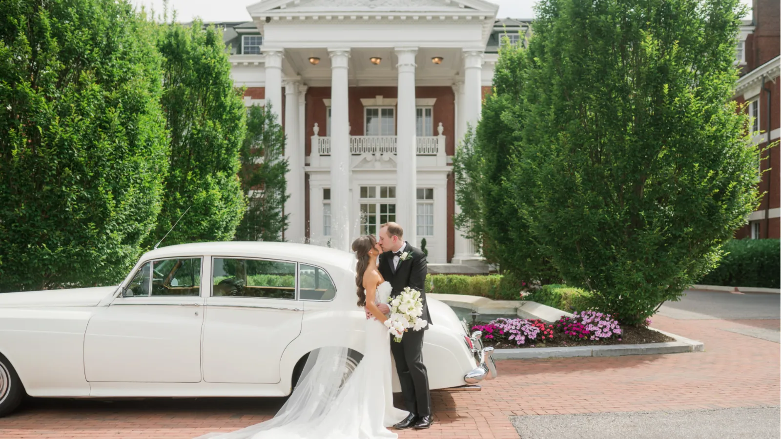 Kristen and Joe with a vintage Rolls-Royce at a Long Island mansion wedding