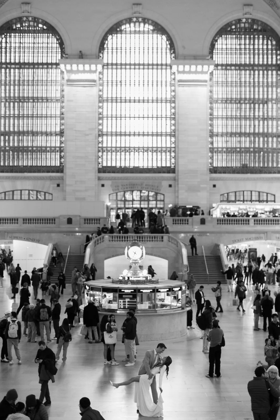 Bride and groom dip kiss in the main concourse of Grand Central Terminal, NYC wedding photographer